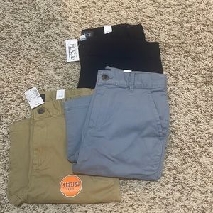 Three pairs of Chino shorts boys size 8, gray navy and khaki brand new with tags